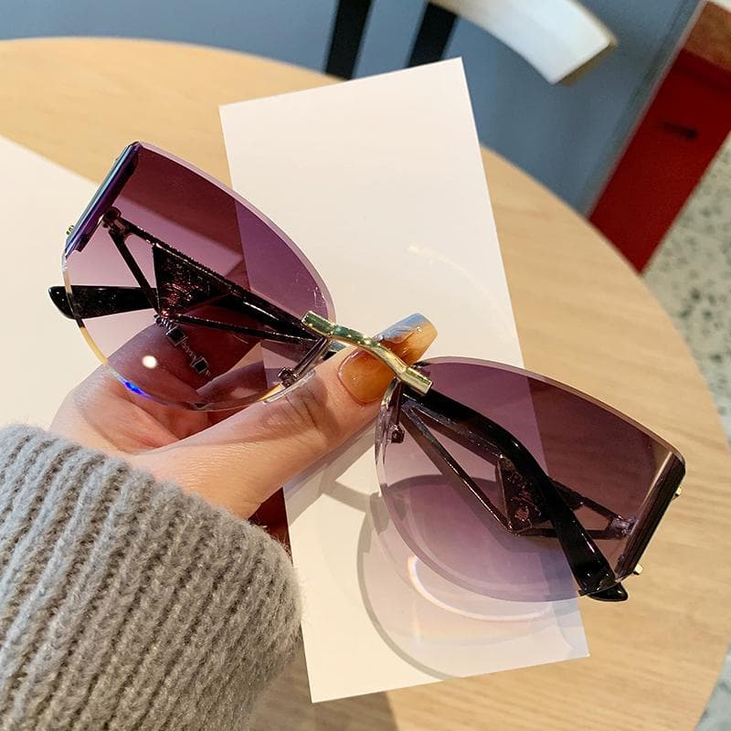 New Women Frameless Sunglasses Hollow Metal Frames Cat Eye Sun Protection UV Blocking Stylish Glasses 90311