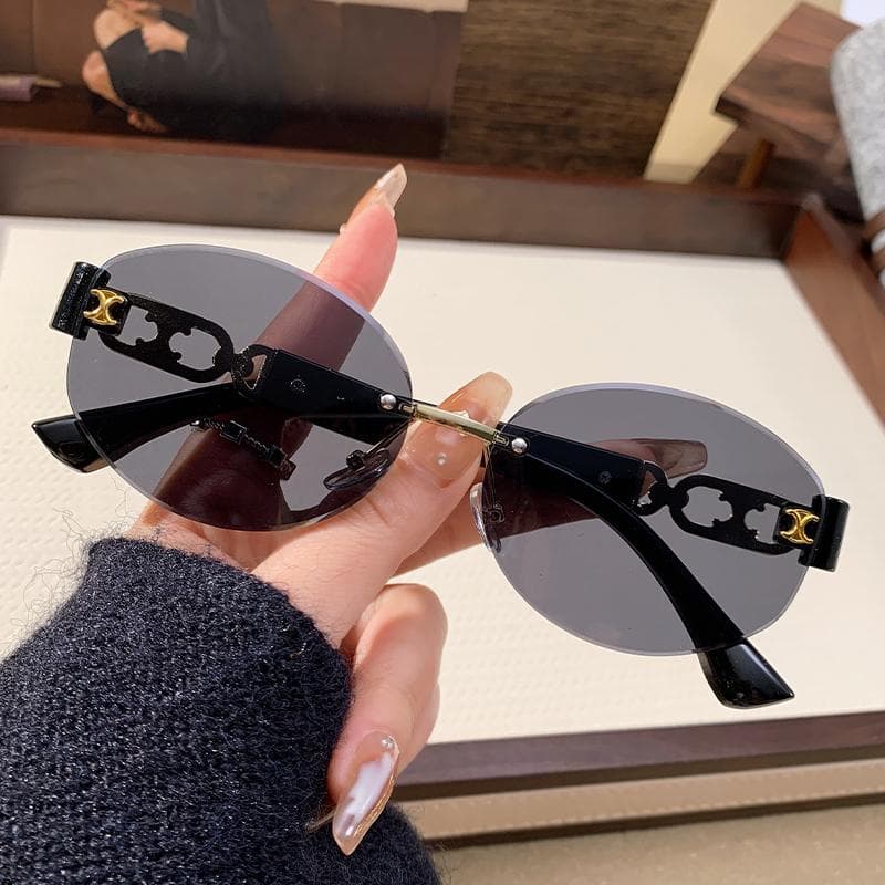New Fashionable Women Metal Frameless Sunglasses Hollow Elliptical Design UV Protection Glasses 90309