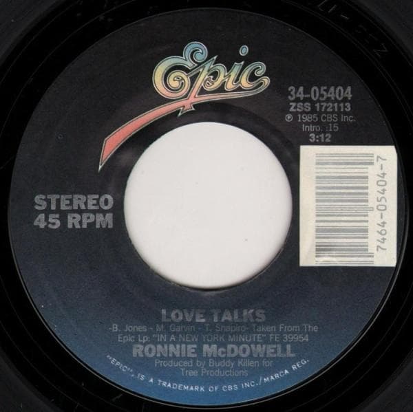 7inch Record RONNIE MCDOWELL - Love Talks / She Lays Me Down 3405404 Epic 1985 US Folk Used