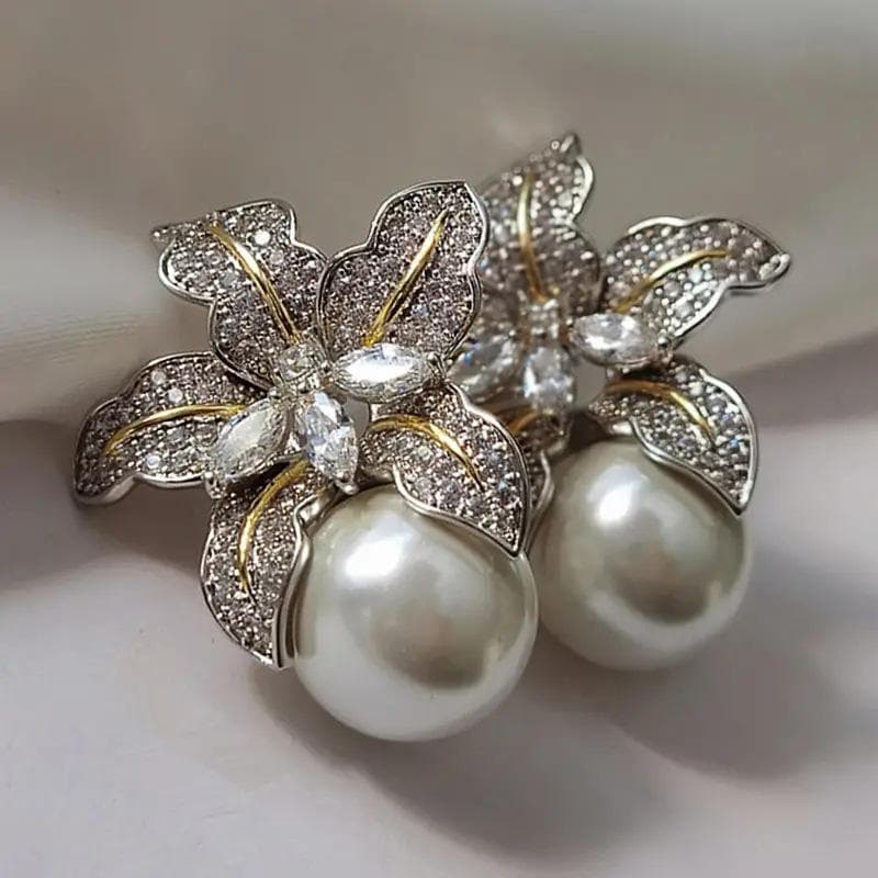 Two-color lily earrings female luxury temperament imitation Pearl earrings personalized Joker earrings.