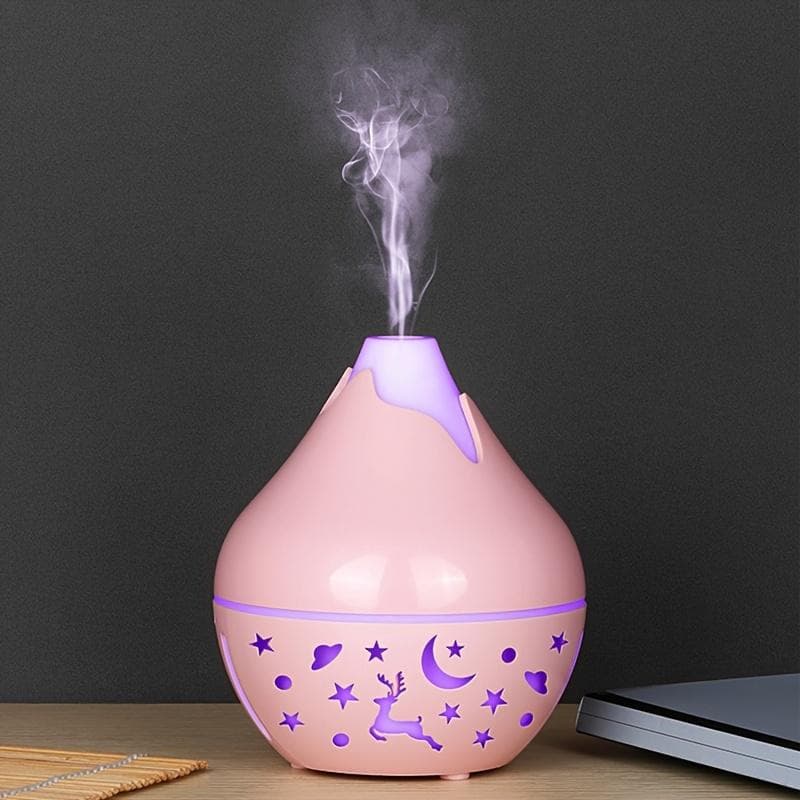A USB powered humidifier, aromatherapy essential oil diffuser, silent operation, plastic, cool mist, 36V or less, for bedroom, home, office pink