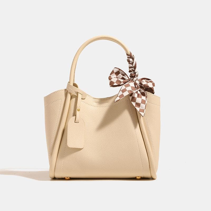 Large-capacity, Stylish, Versatile Commuting Bag Made of Soft Leather with A Lychee Texture. It Is A Single-shoulder, Crossbody, Hand-held Tote Bag